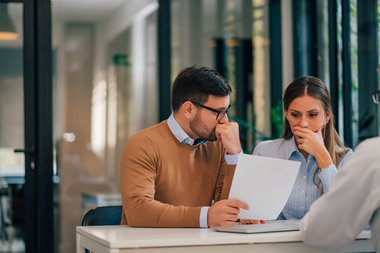 man-woman-thinking-about-real-estate-options